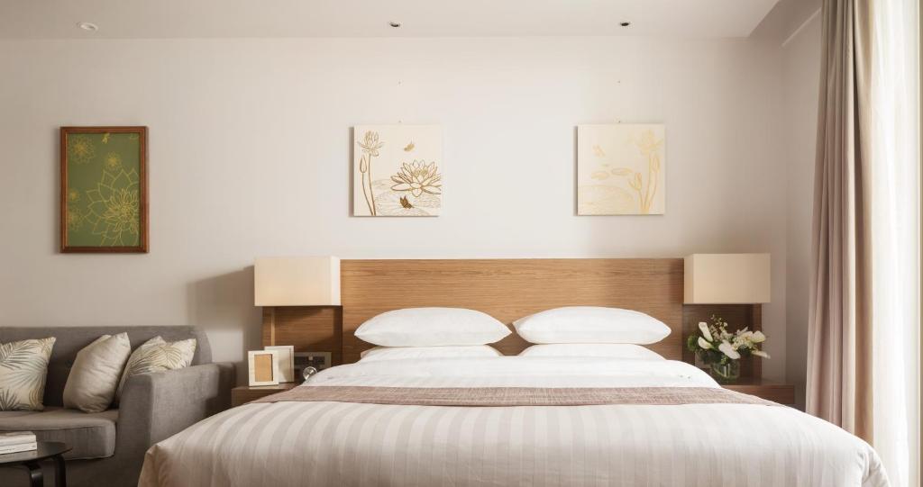 Postel nebo postele na pokoji v ubytování Hotel Emion Phnom Penh