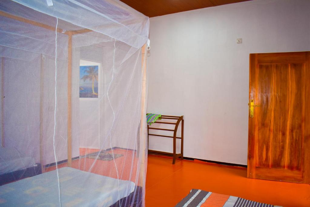 Postel nebo postele na pokoji v ubytování De Perla Resort