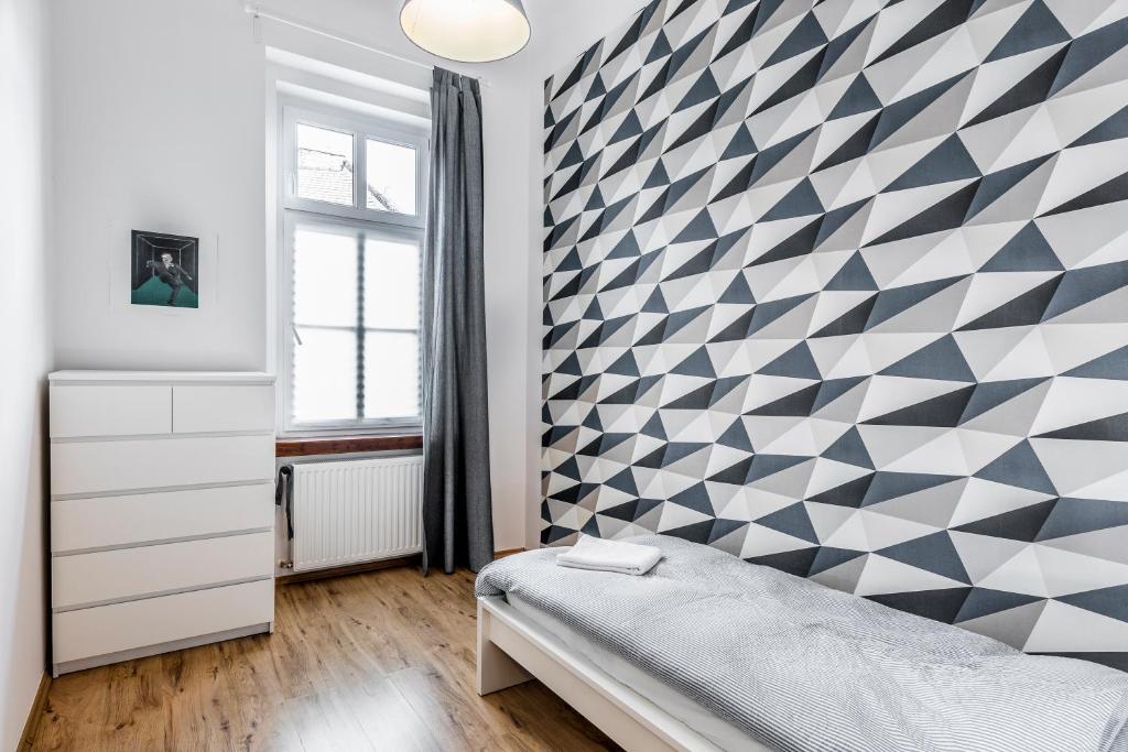 Postel nebo postele na pokoji v ubytování French Touch Apartment with Free Parking