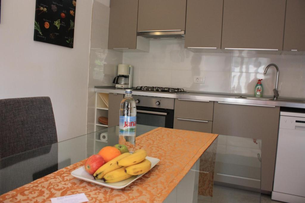 Kuchyň nebo kuchyňský kout v ubytování AURA Residence