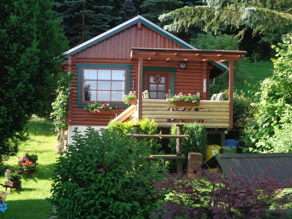 a cabin in the middle of a garden at Ferienhaus Sachse in Pockau