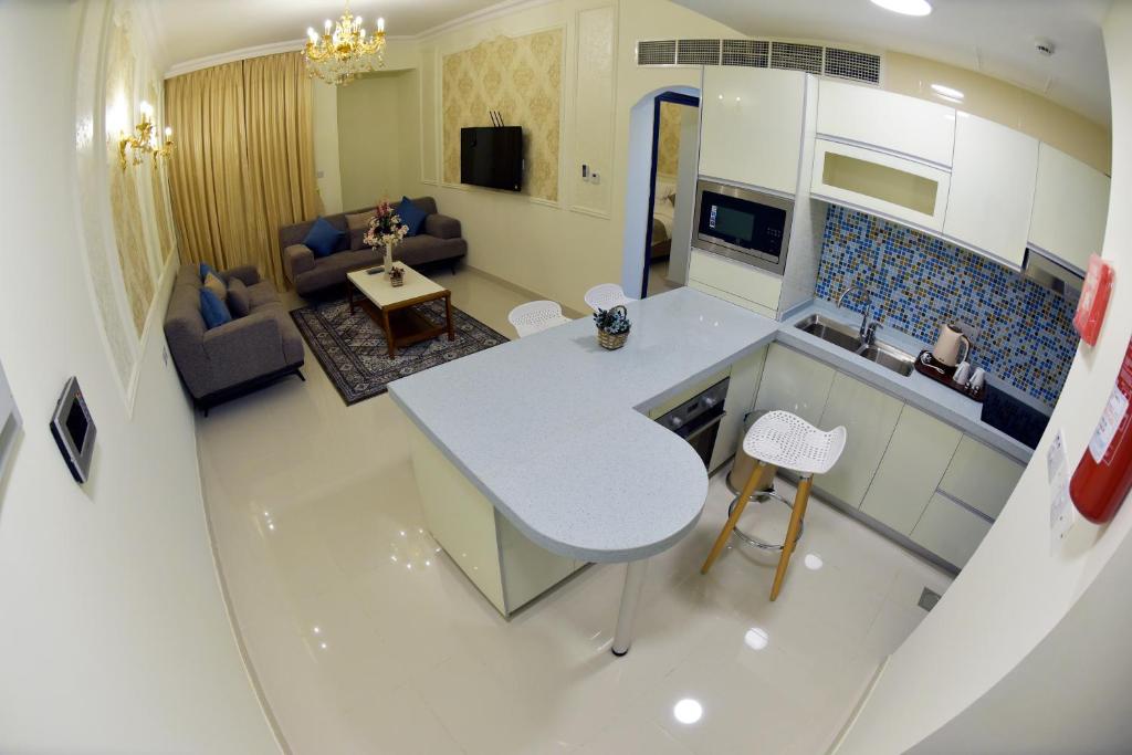 TV a/nebo společenská místnost v ubytování A'Sinamar Hotel Apartment