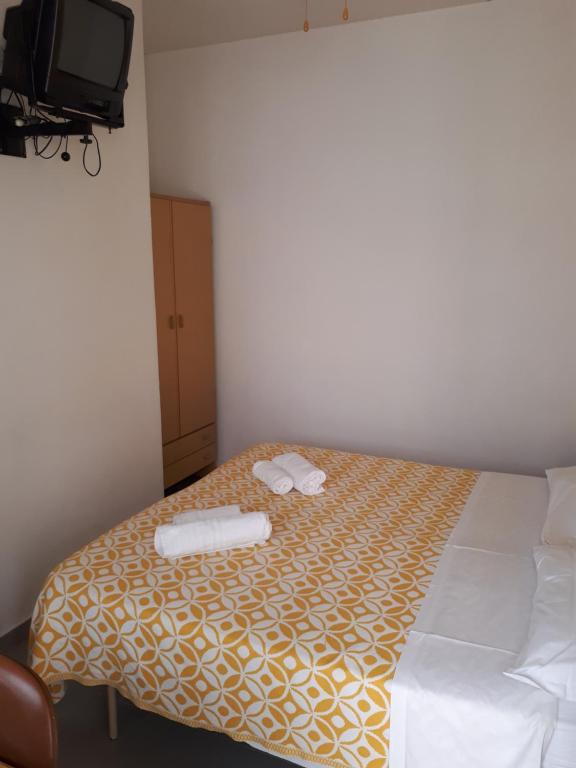Postel nebo postele na pokoji v ubytování Hotel Ottavia