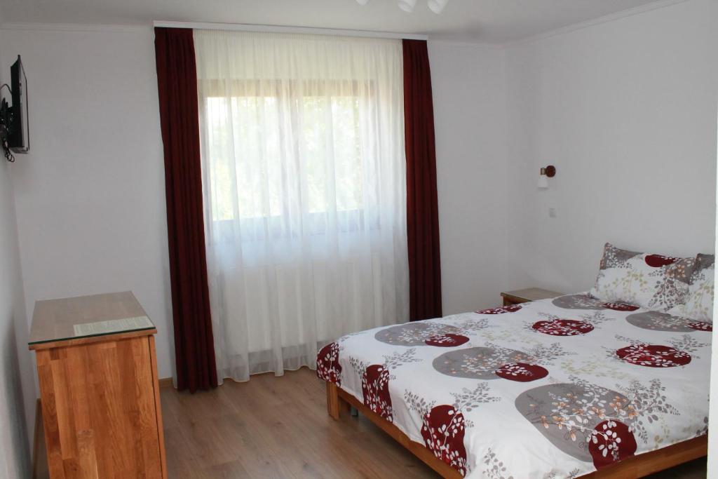 Postel nebo postele na pokoji v ubytování Casa Moldovan