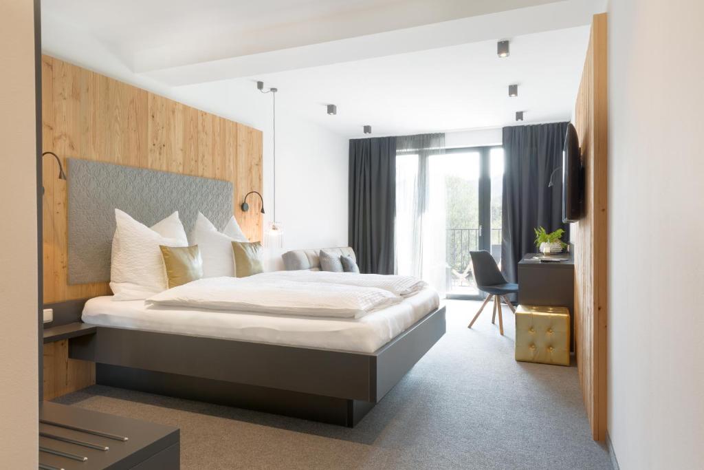 מיטה או מיטות בחדר ב-Gasthof Erlauftalerhof