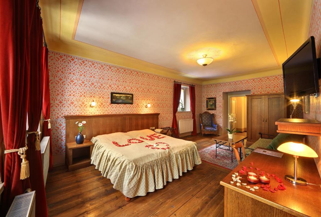 Ένα ή περισσότερα κρεβάτια σε δωμάτιο στο Hotel Edward Kelly