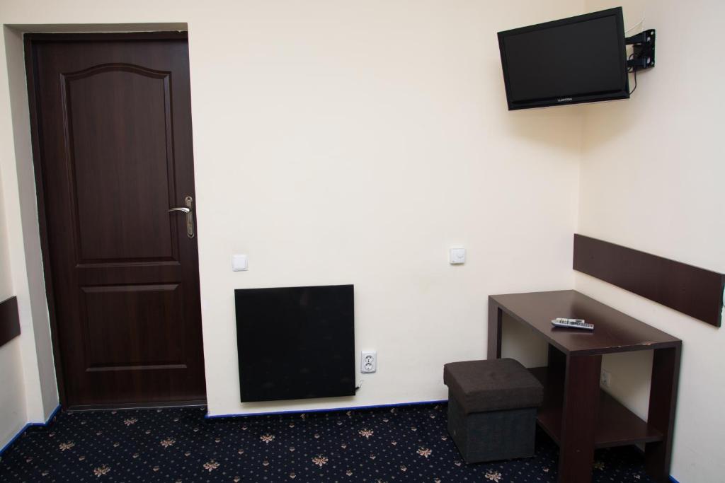 TV a/nebo společenská místnost v ubytování Faraon Hotel