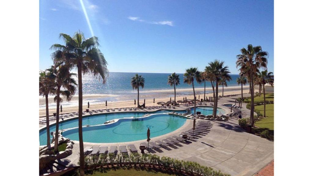 a view of a swimming pool and the beach at Sonoran Sea Resort in Puerto Peñasco