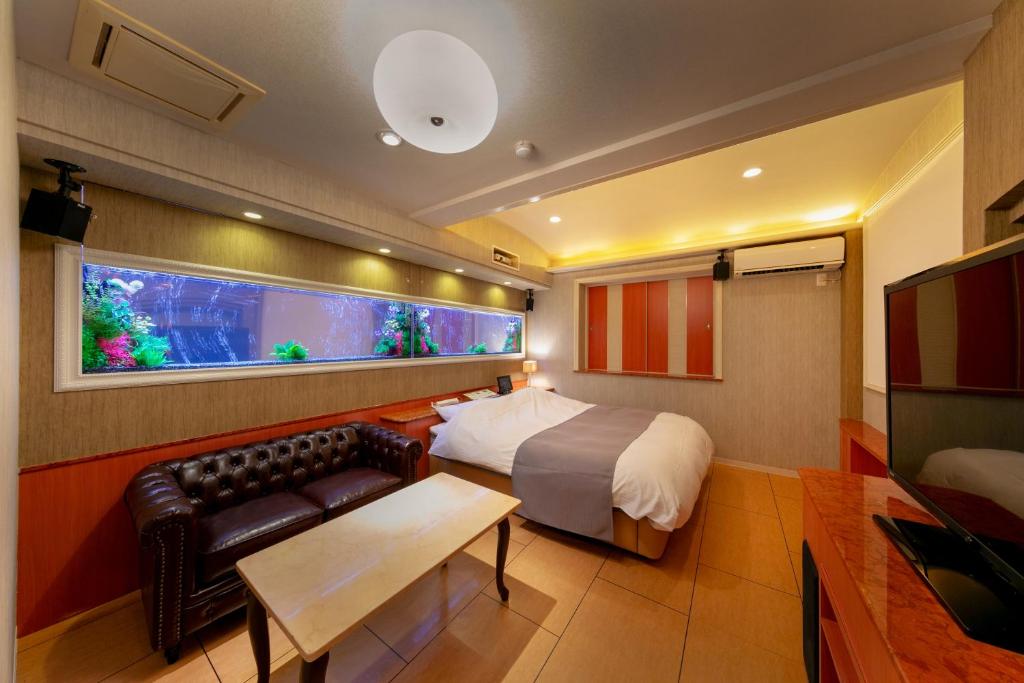 Postel nebo postele na pokoji v ubytování Hotel Luna Kashiba (Adult Only)