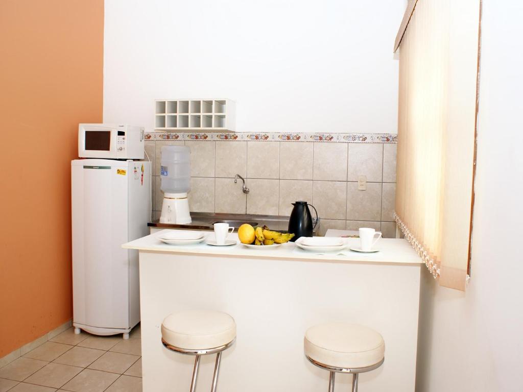 Kuchyň nebo kuchyňský kout v ubytování Hotel - Apart-hotel Chalé Executivo