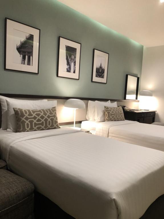เตียงในห้องที่ Evergreen Place Siam by UHG