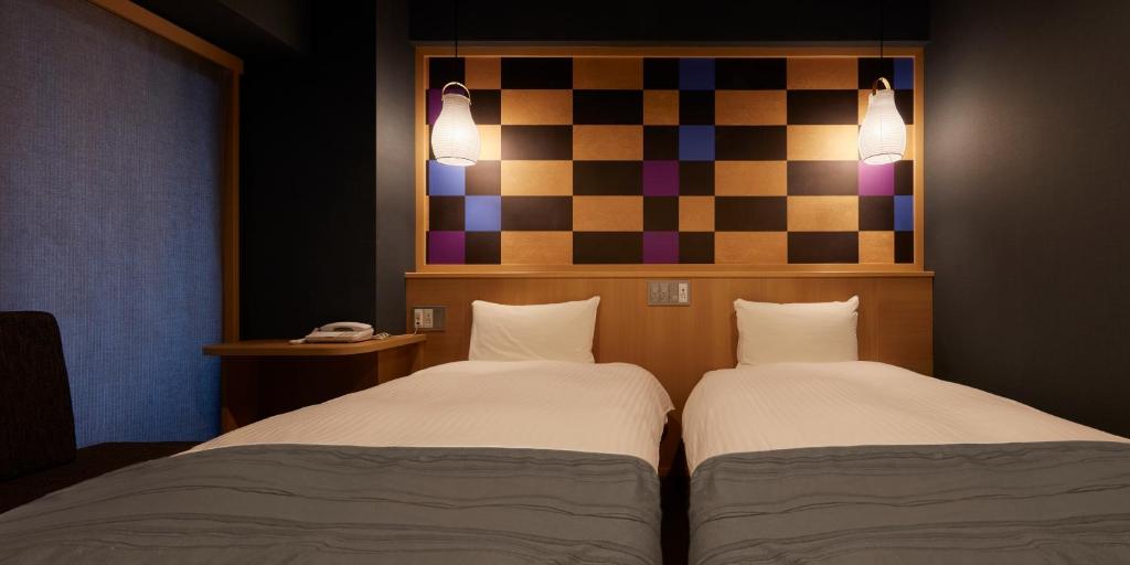 Postel nebo postele na pokoji v ubytování Sakura Sky Hotel