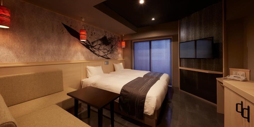 Postel nebo postele na pokoji v ubytování Sakura Sky Hotel