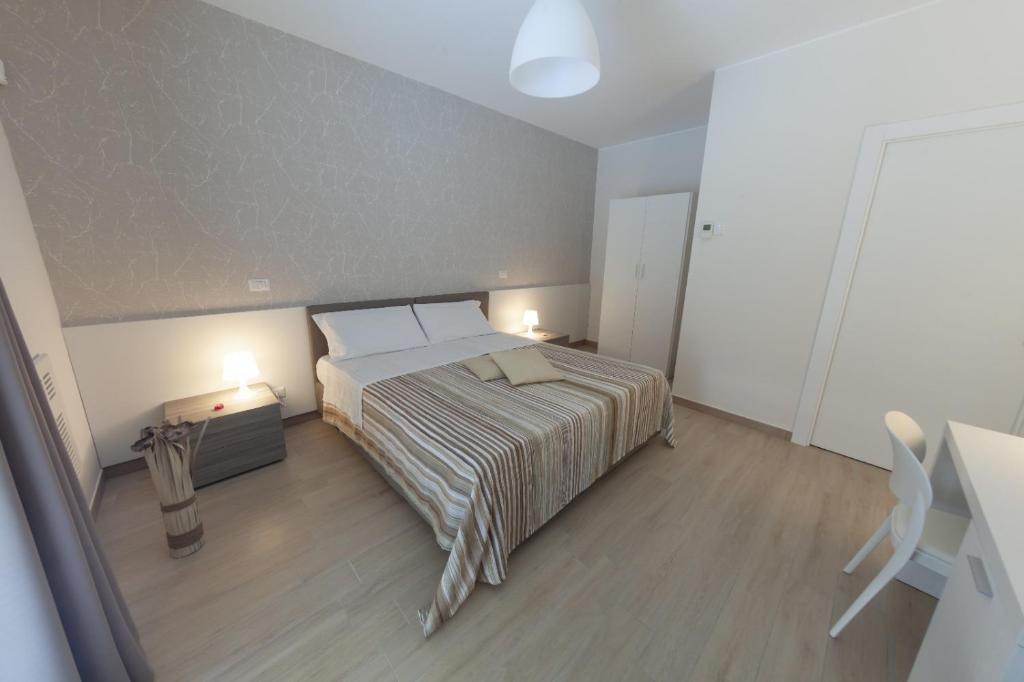 Postel nebo postele na pokoji v ubytování Ofra Matera