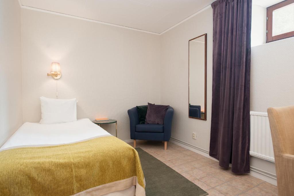 Postel nebo postele na pokoji v ubytování Home Hotel Kung Oscar