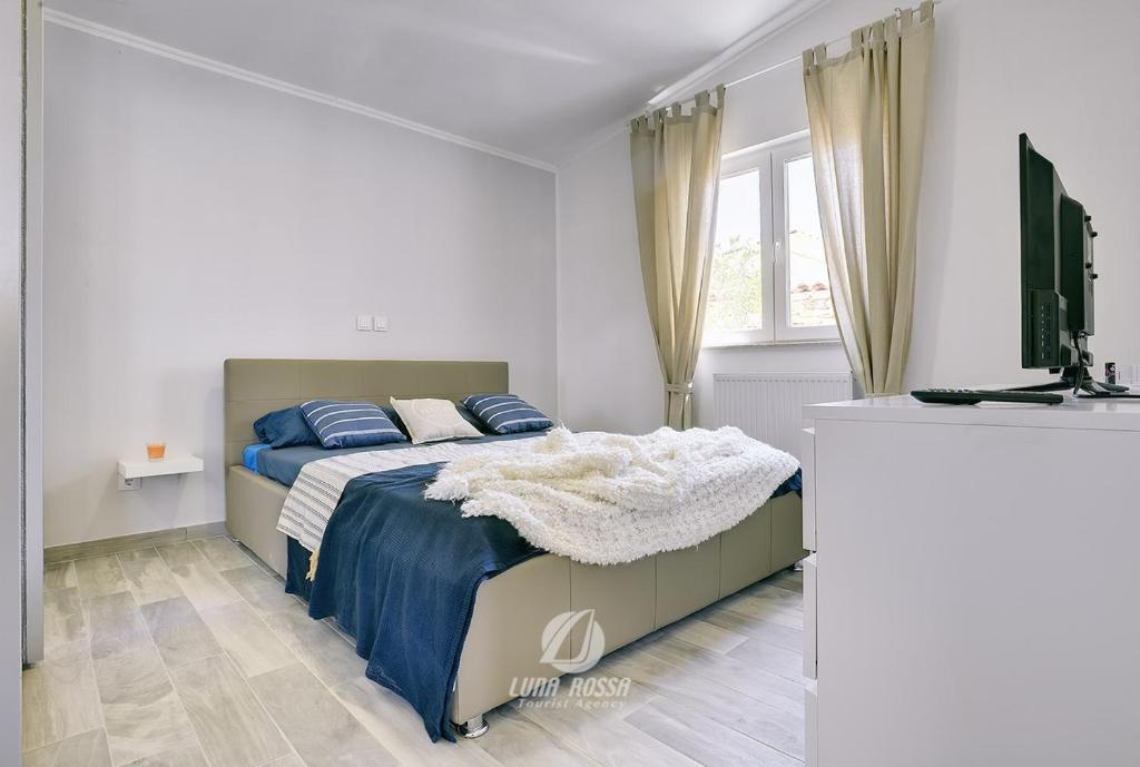 Posteľ alebo postele v izbe v ubytovaní Villa Emily