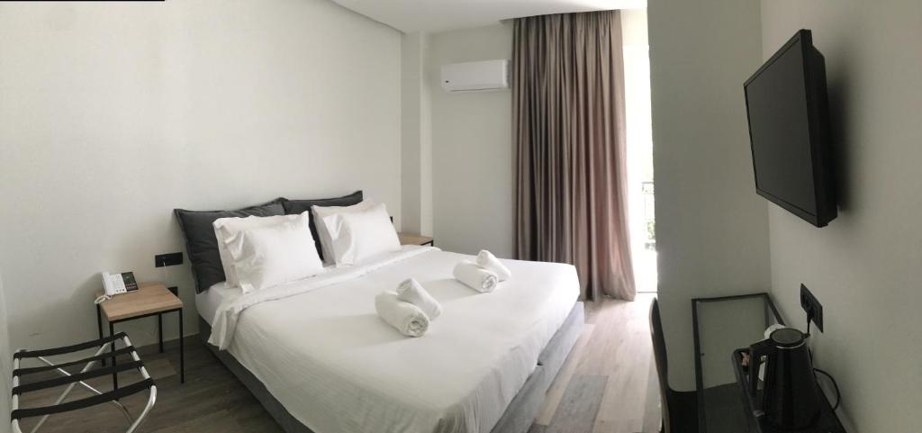 Postel nebo postele na pokoji v ubytování Athens coast hotel