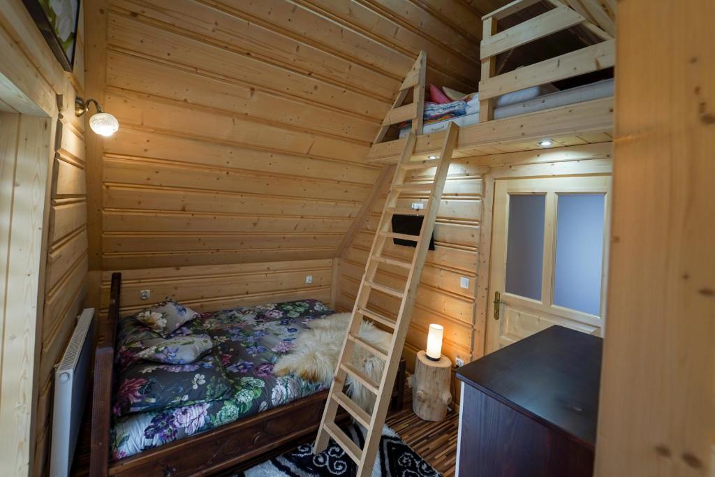 Postel nebo postele na pokoji v ubytování Domek Regionalny Dan Pio