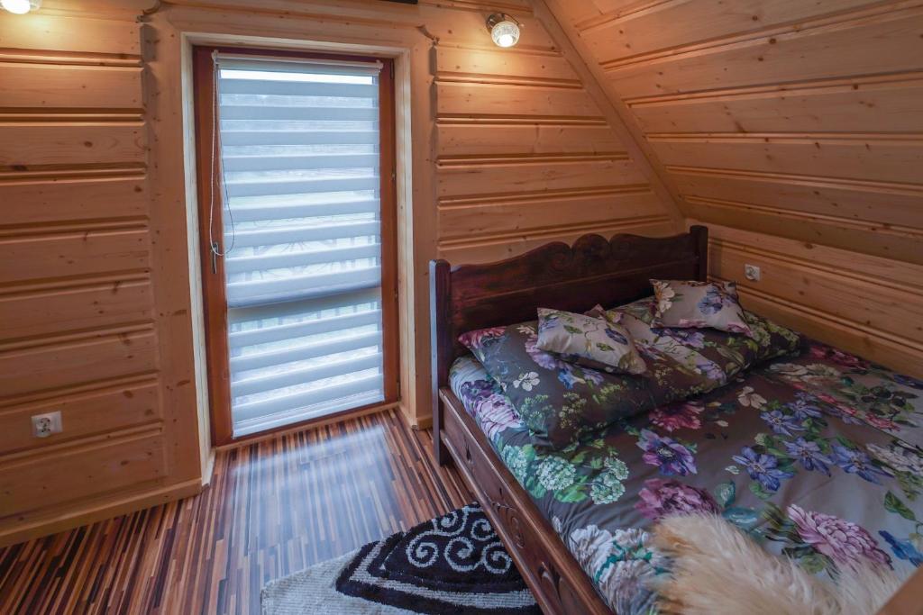 Postel nebo postele na pokoji v ubytování Domek Regionalny Dan Pio