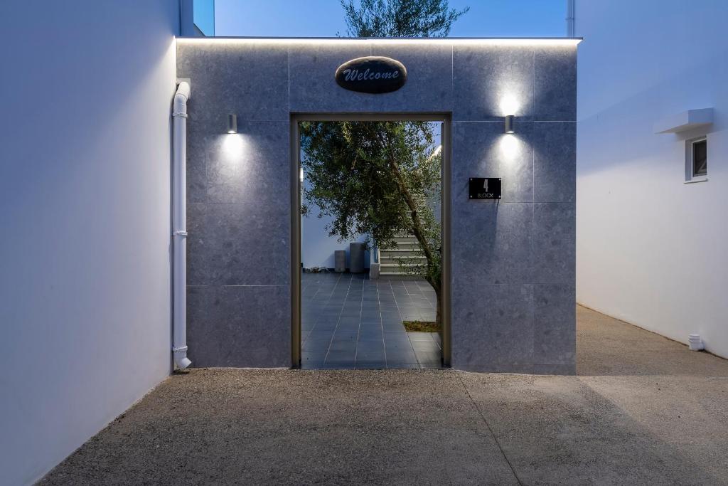 a door to a building with a sign on it at Diamond Boutique Hotel in Kos