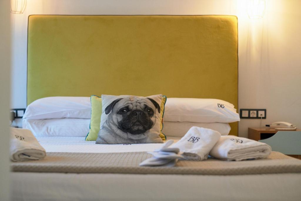 Postel nebo postele na pokoji v ubytování Blue Bottle Boutique Hotel