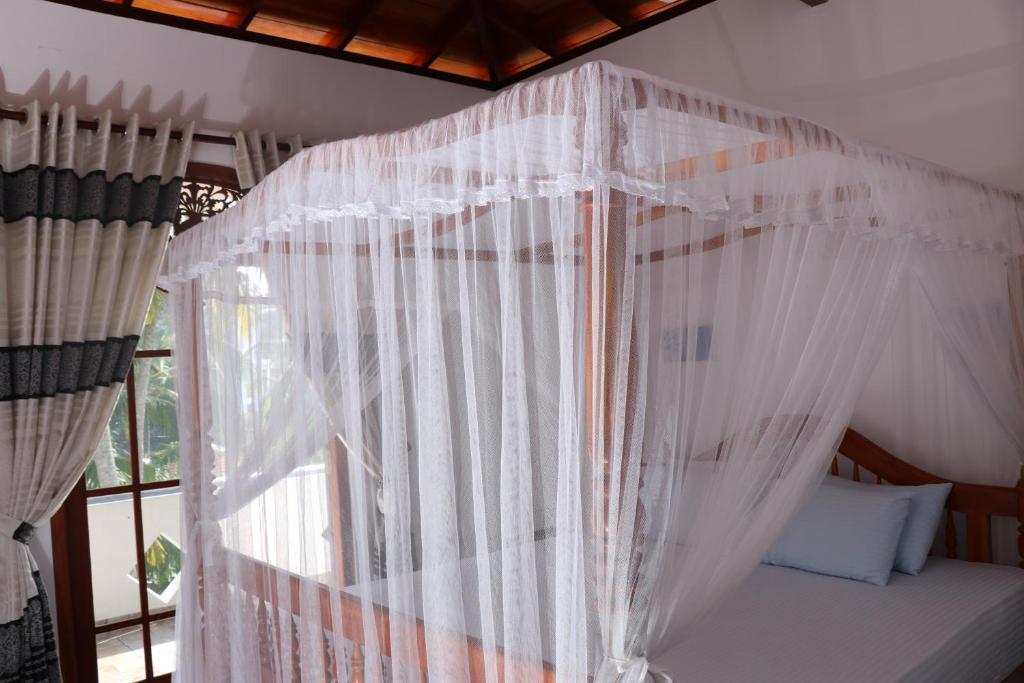 Letto o letti in una camera di Villa Sureka