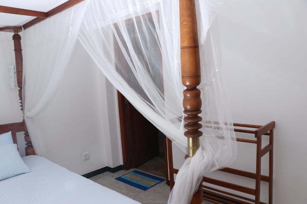 Letto o letti in una camera di Villa Sureka