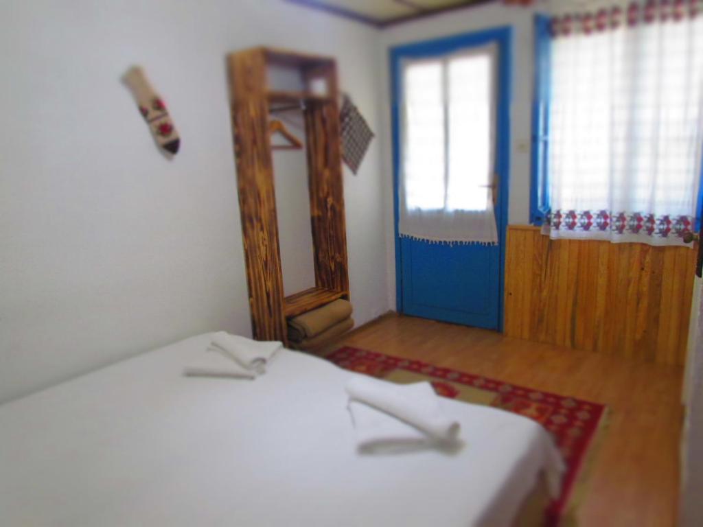 Postel nebo postele na pokoji v ubytování Amazon Antique