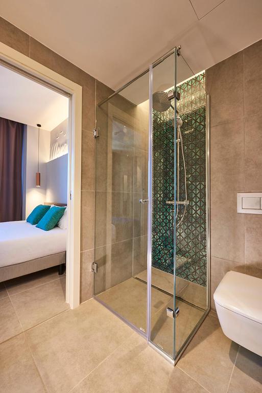 Koupelna v ubytování M Suite Hotel