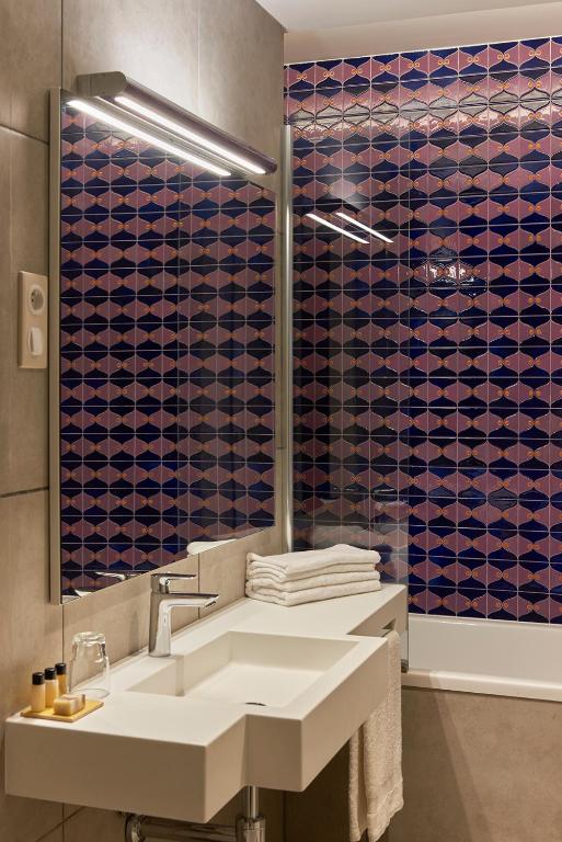 Koupelna v ubytování M Suite Hotel
