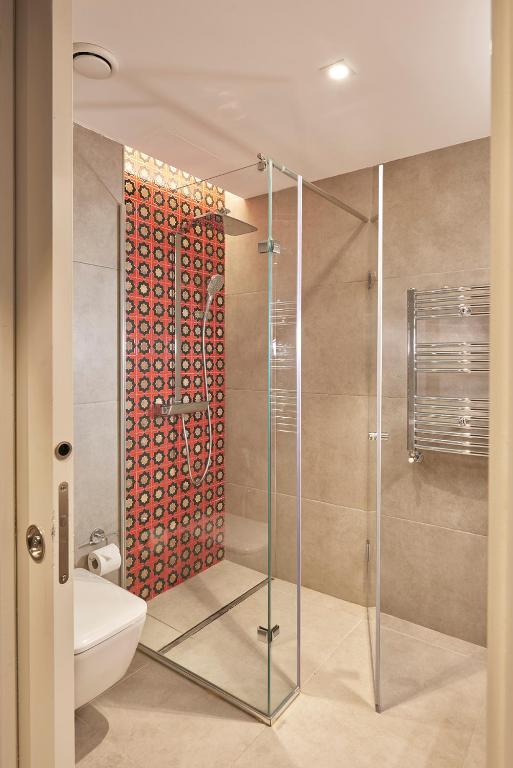 Koupelna v ubytování M Suite Hotel