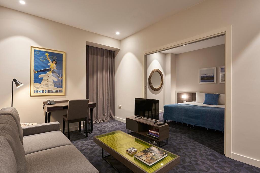 TV a/nebo společenská místnost v ubytování M Suite Hotel