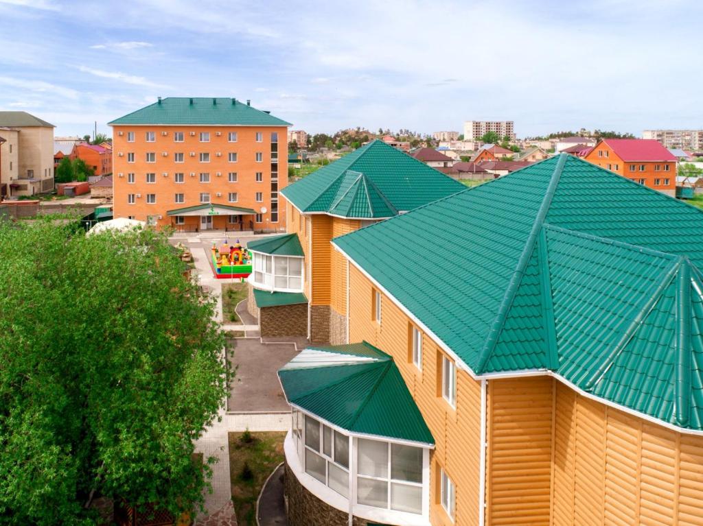 an overhead view of a building with a green roof at Koktem Burabay in Borovoye