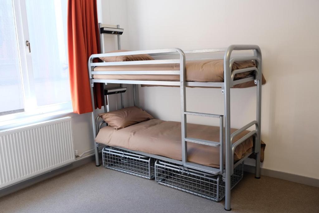 Postel nebo postele na pokoji v ubytování Black Isle Hostel