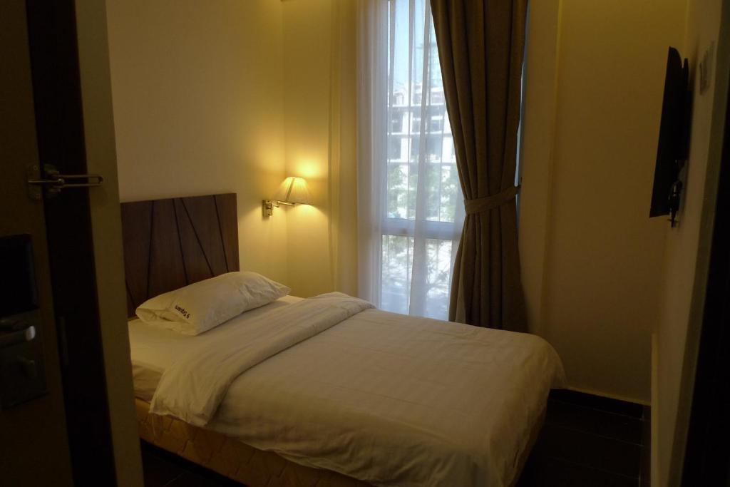 Postel nebo postele na pokoji v ubytování 9 Square Hotel - Petaling Jaya