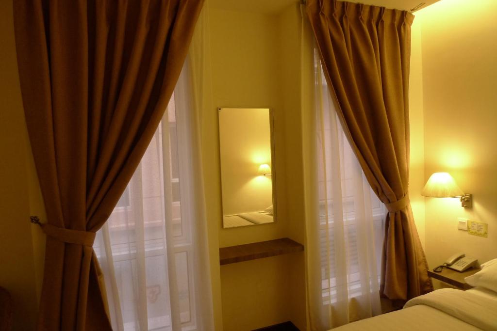 Postel nebo postele na pokoji v ubytování 9 Square Hotel - Petaling Jaya