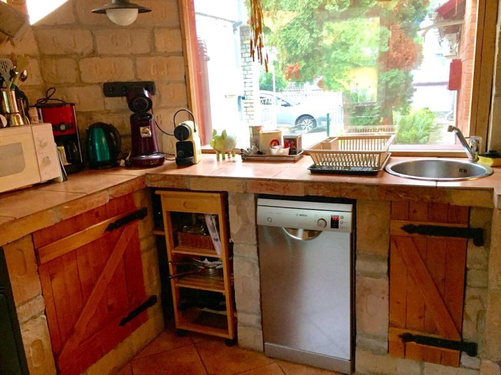 Kuchyňa alebo kuchynka v ubytovaní MG Apartman