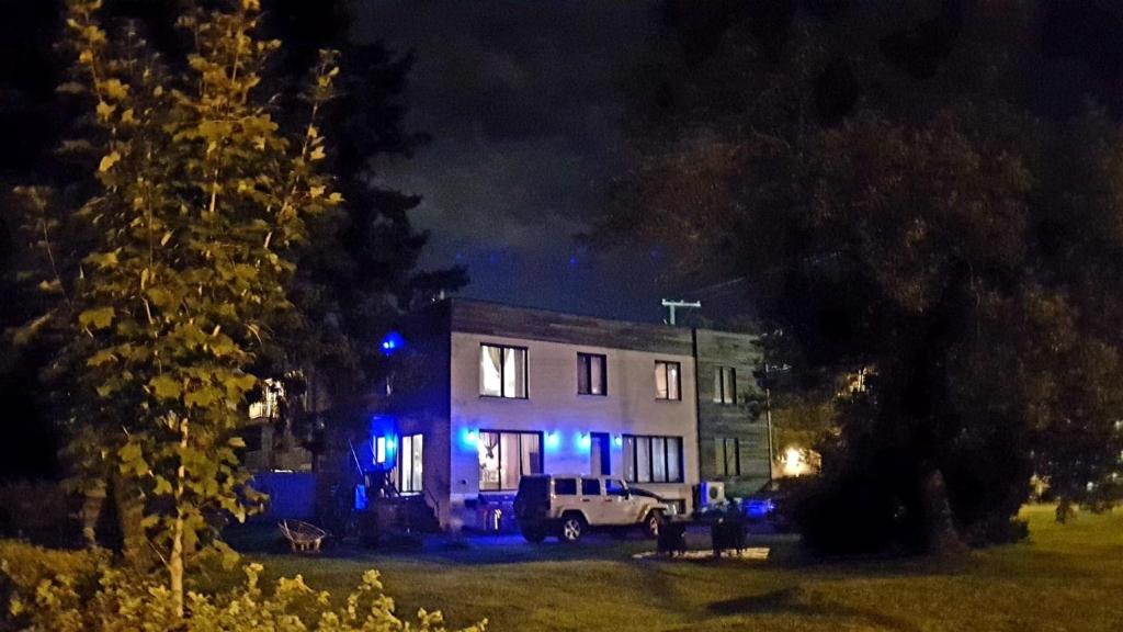 a house with blue lights in front of it at night at Gîte Zazen in Mont-Laurier