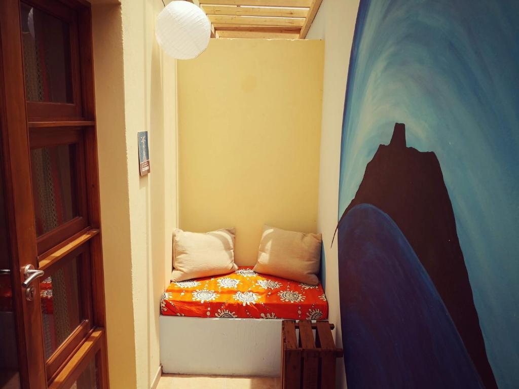 Postel nebo postele na pokoji v ubytování Casa Strela B&B Tarrafal