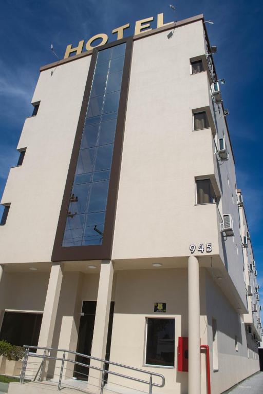 a building with a hotel sign on it at Hotel Marrocos in Pelotas