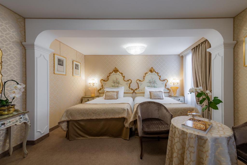 Postel nebo postele na pokoji v ubytování Hotel Concordia