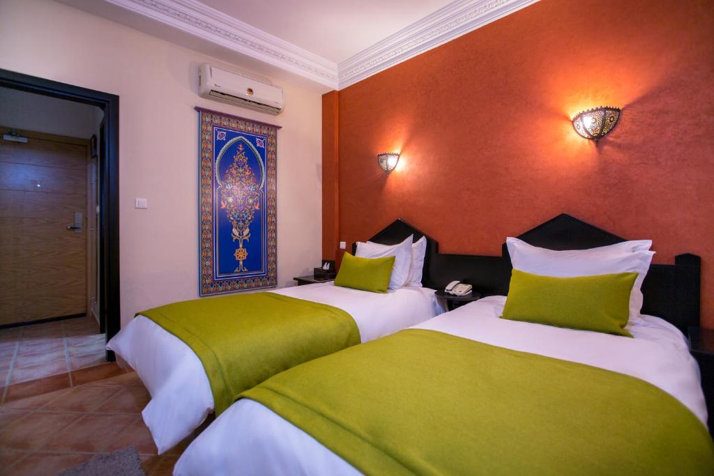 Postel nebo postele na pokoji v ubytování Atlantic Hotel Agadir