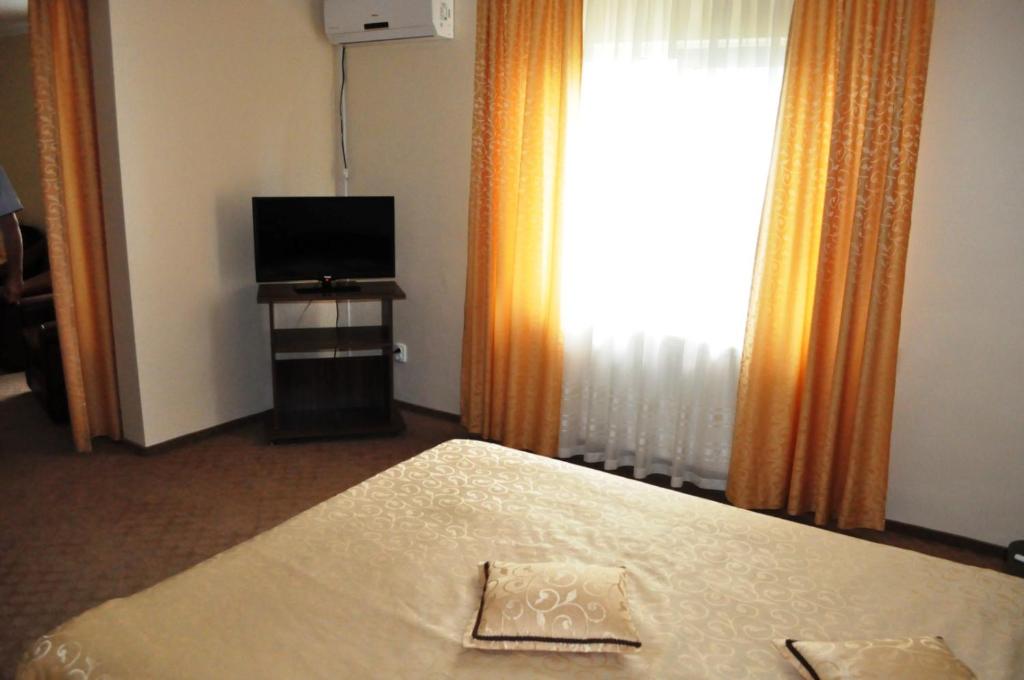 Postel nebo postele na pokoji v ubytování Hotel Andrei