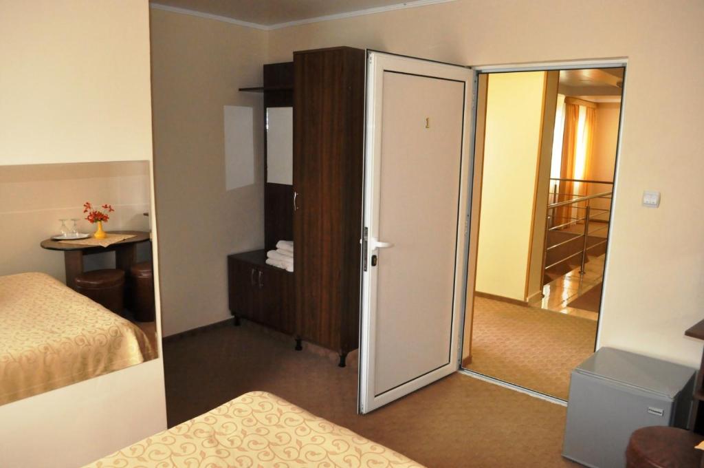 Postel nebo postele na pokoji v ubytování Hotel Andrei