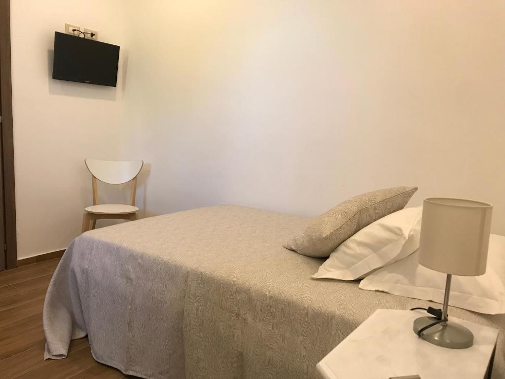Postel nebo postele na pokoji v ubytování Hotel Cambogia