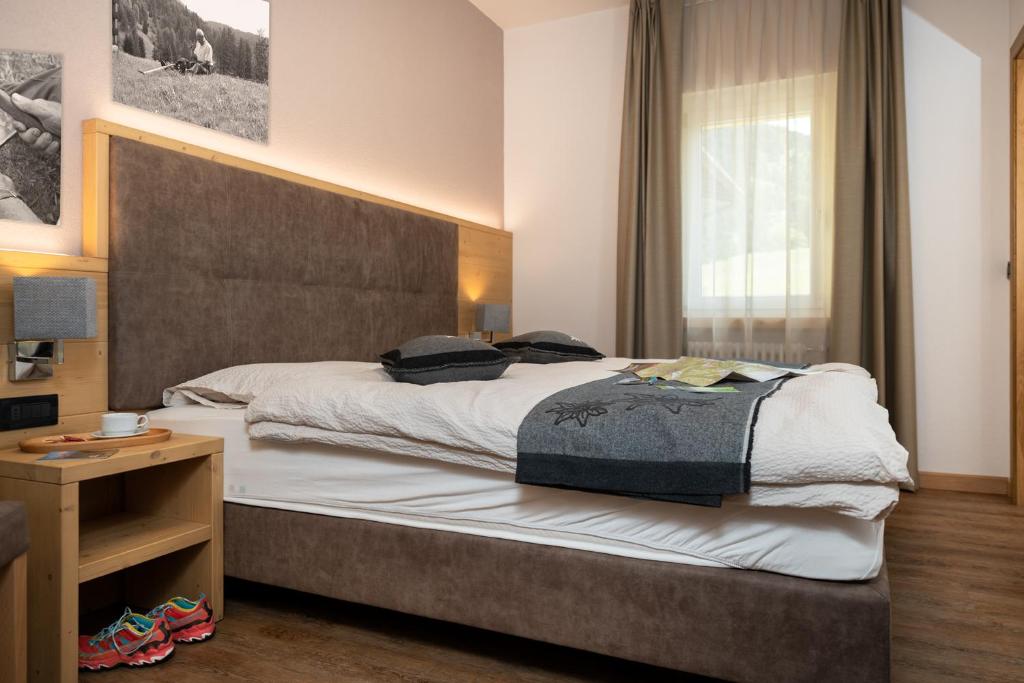 Postel nebo postele na pokoji v ubytování GARNI' Margherita