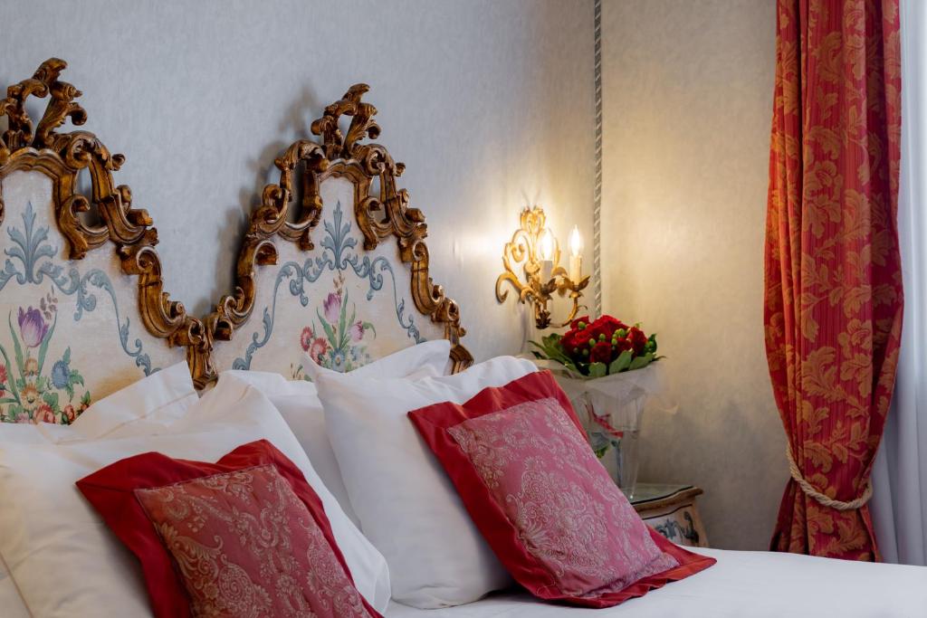 Postel nebo postele na pokoji v ubytování Hotel Concordia