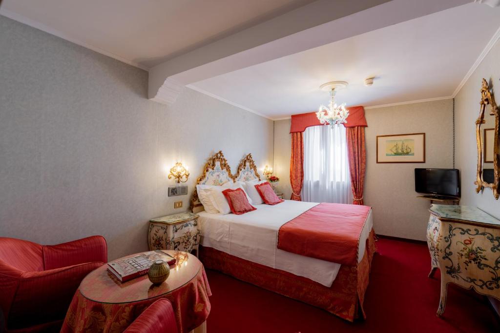Postel nebo postele na pokoji v ubytování Hotel Concordia