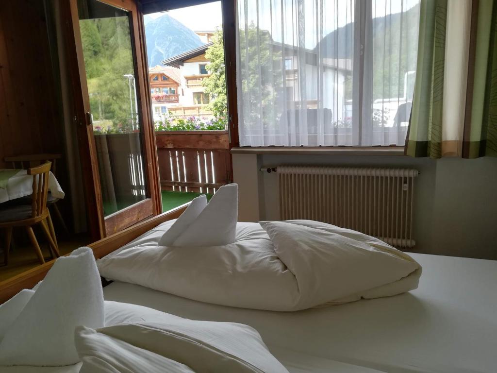 Postel nebo postele na pokoji v ubytování Haus Kristall
