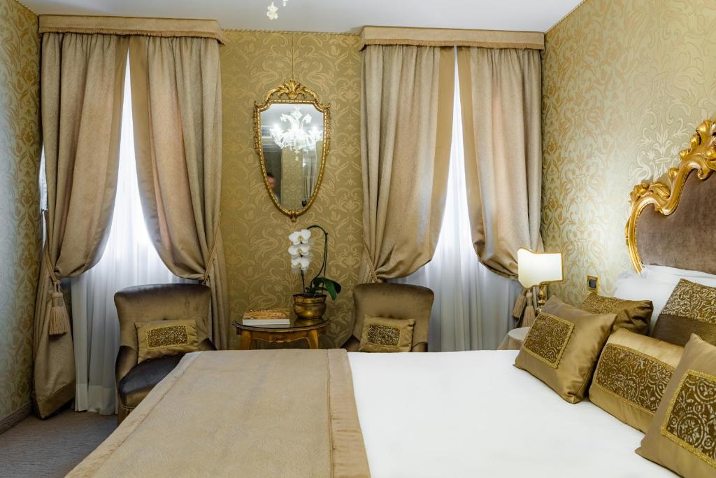 Postel nebo postele na pokoji v ubytování Hotel Concordia